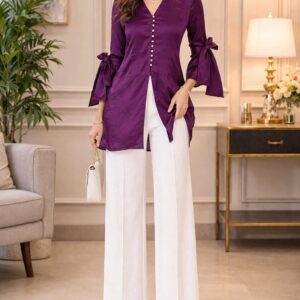 Plum Pearl Top for women in purple tissue silk with pearl buttons, front slit, bow-tie sleeves and white wide-leg pants