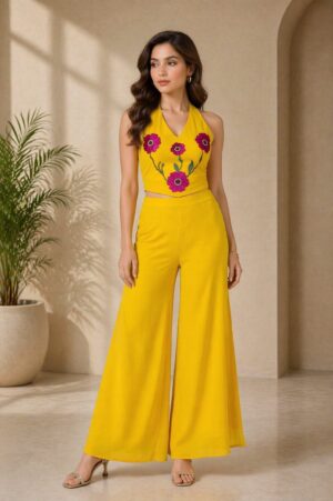 Sunshine Bloom Co-Ord Set for women featuring a yellow georgette halter neck top with floral patch work and flowy wide leg pants for festive wear styling.